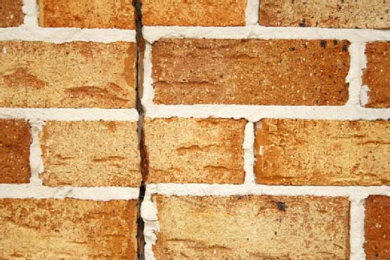 The big damaged bricks in foundation at Euless, TX